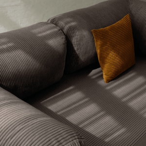 Primyhome coffee brown corduroy convertible sofa bed fabric close-up with soft natural light shadows