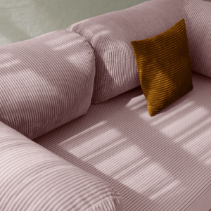 Primyhome pink corduroy convertible sofa bed fabric close-up with soft natural light shadows